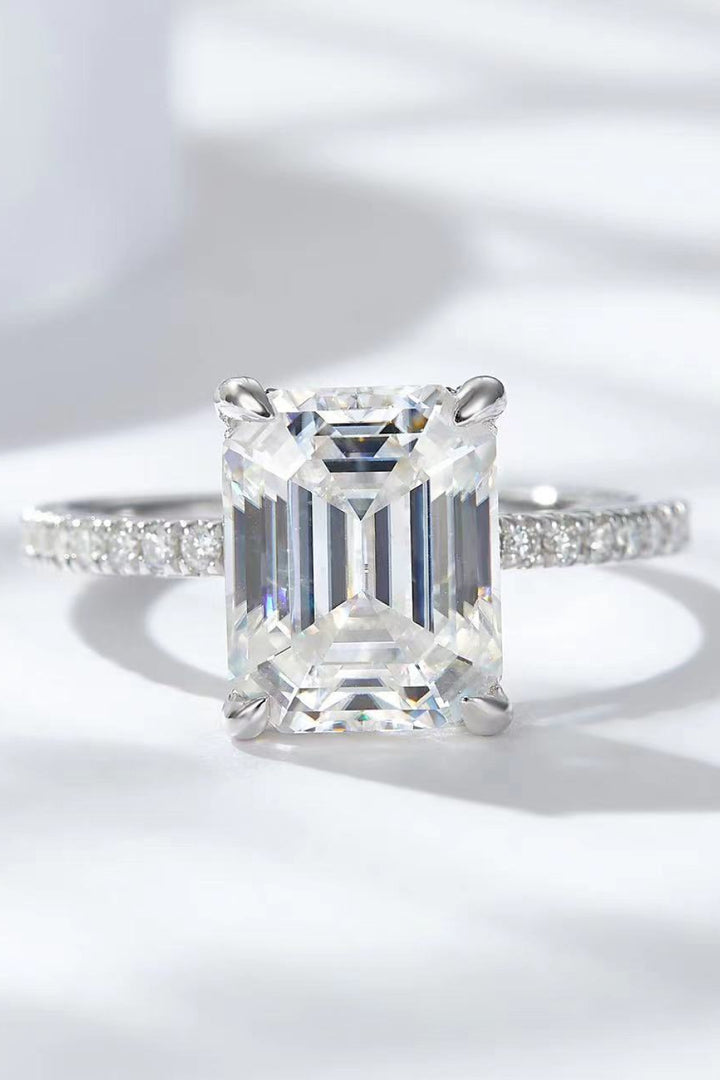 Moissanite side stone ring, Lab-created gemstone, 5-carat statement piece, Sparkling centerpiece, Side stone accent ring, Luxury jewelry, Elegant design, High-quality craftsmanship, Affordable glamour, Fine jewelry accessory.